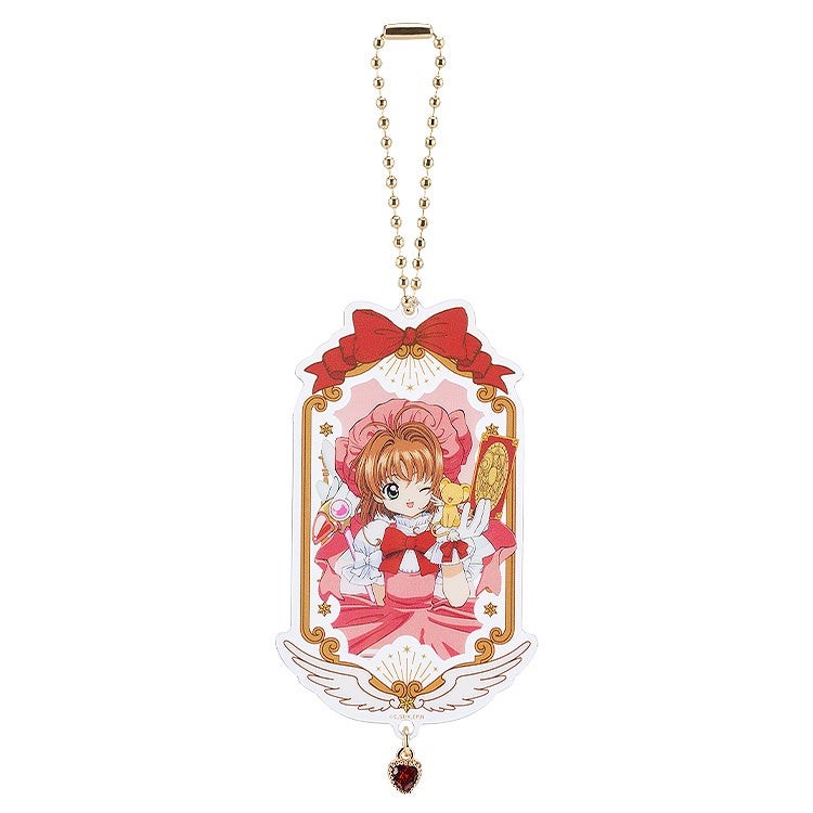 Cardcaptor Sakura 25th Anniversary acrylic keychain with Sakura in a pink dress and gold accents