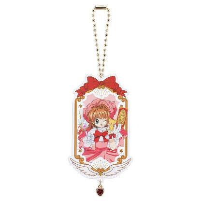 Cardcaptor Sakura 25th Anniversary acrylic keychain with Sakura in a pink dress and gold accents