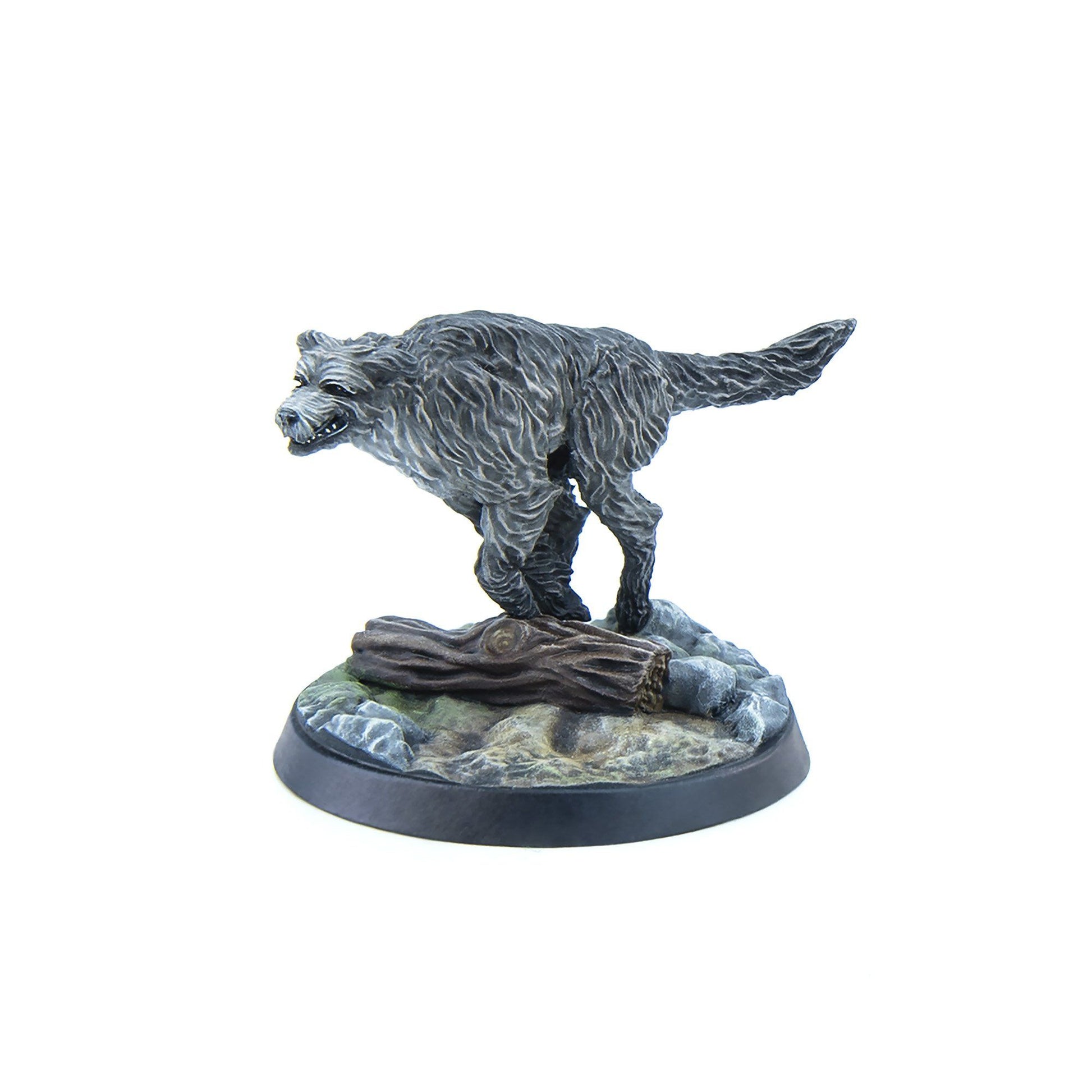 Grey miniature wolf figure lunging forward on a rocky base with a log