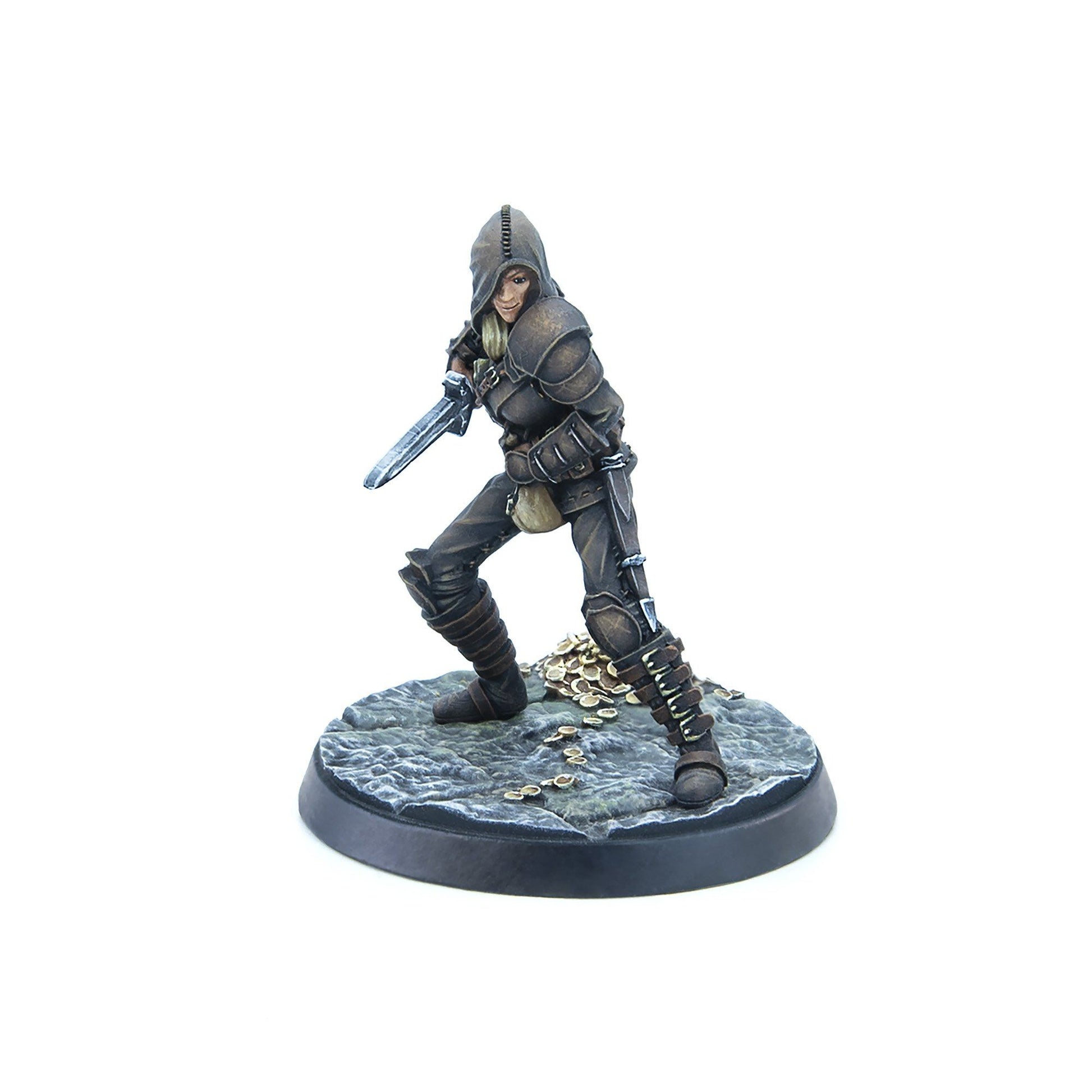 Fantasy miniature: A smiling, hooded rogue in armor holds a dagger on a rocky base with gold coins