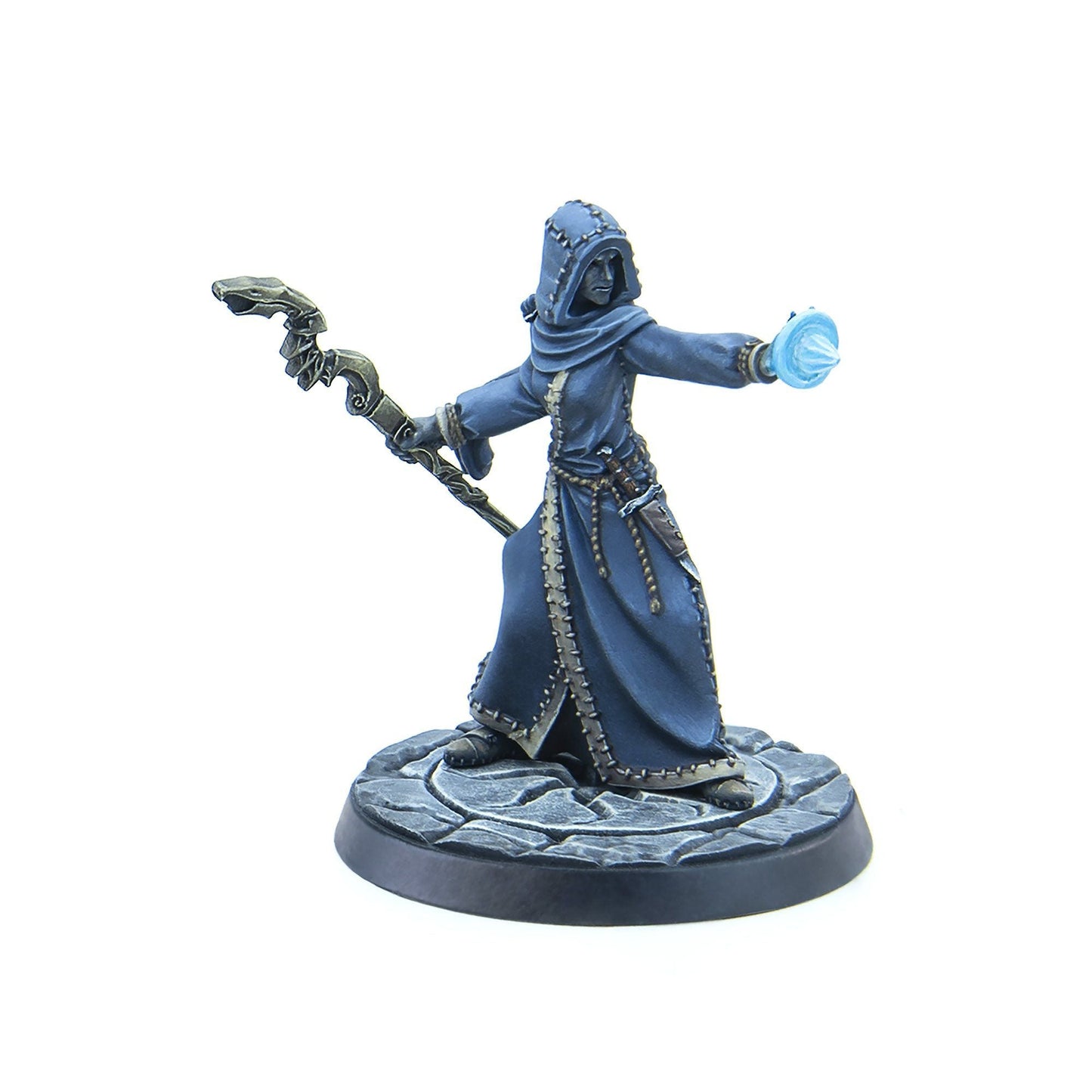 A miniature hooded wizard in blue robes, holding a staff and casting a blue glowing spell from their right hand