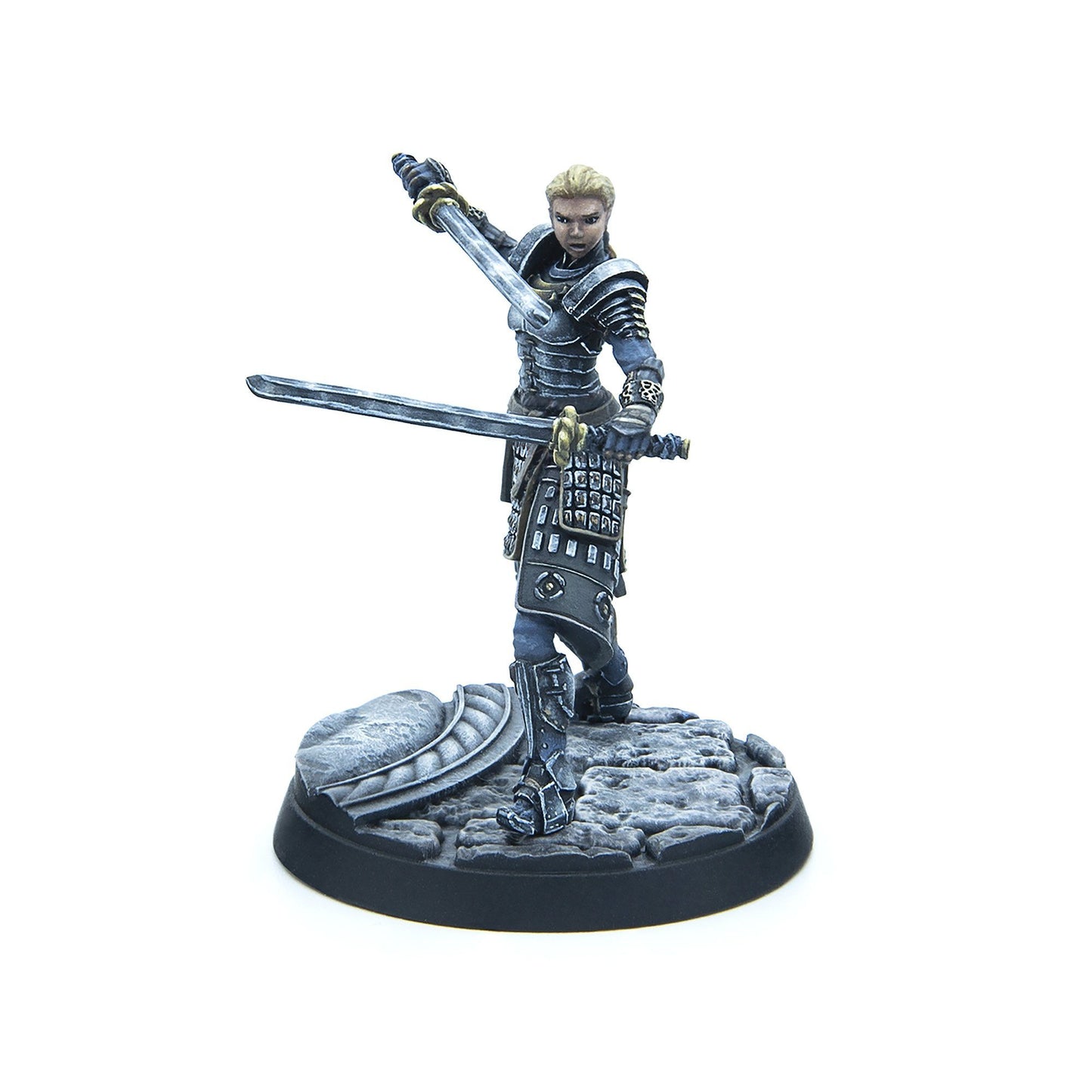 Blonde female miniature in dark armor, dual-wielding swords in a dynamic combat pose on a textured base