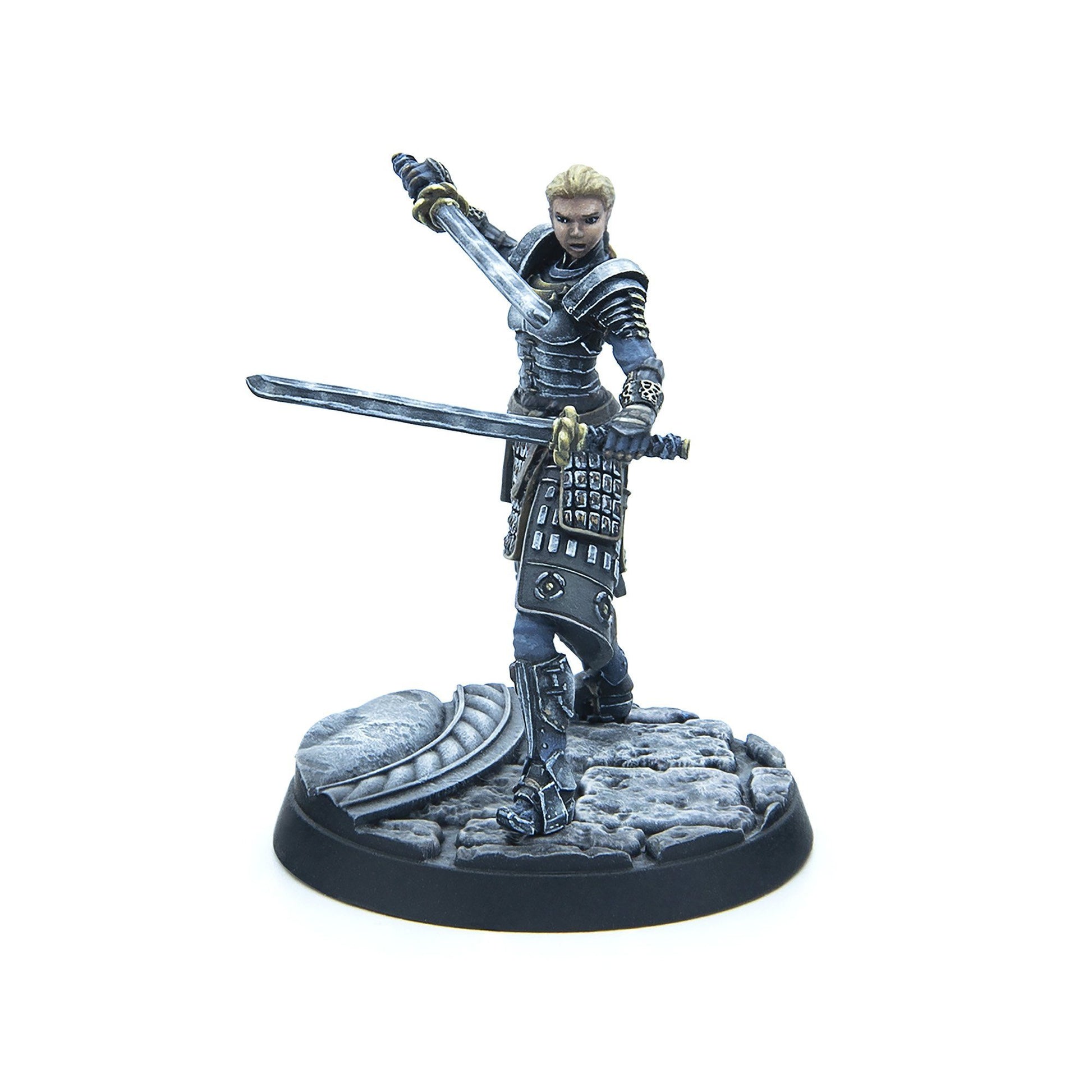 Blonde female miniature in dark armor, dual-wielding swords in a dynamic combat pose on a textured base
