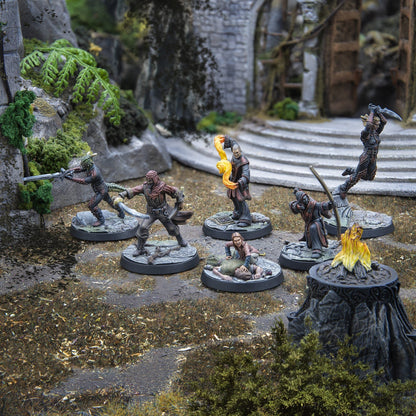 A collection of painted fantasy miniatures depicting a battle in ancient ruins
