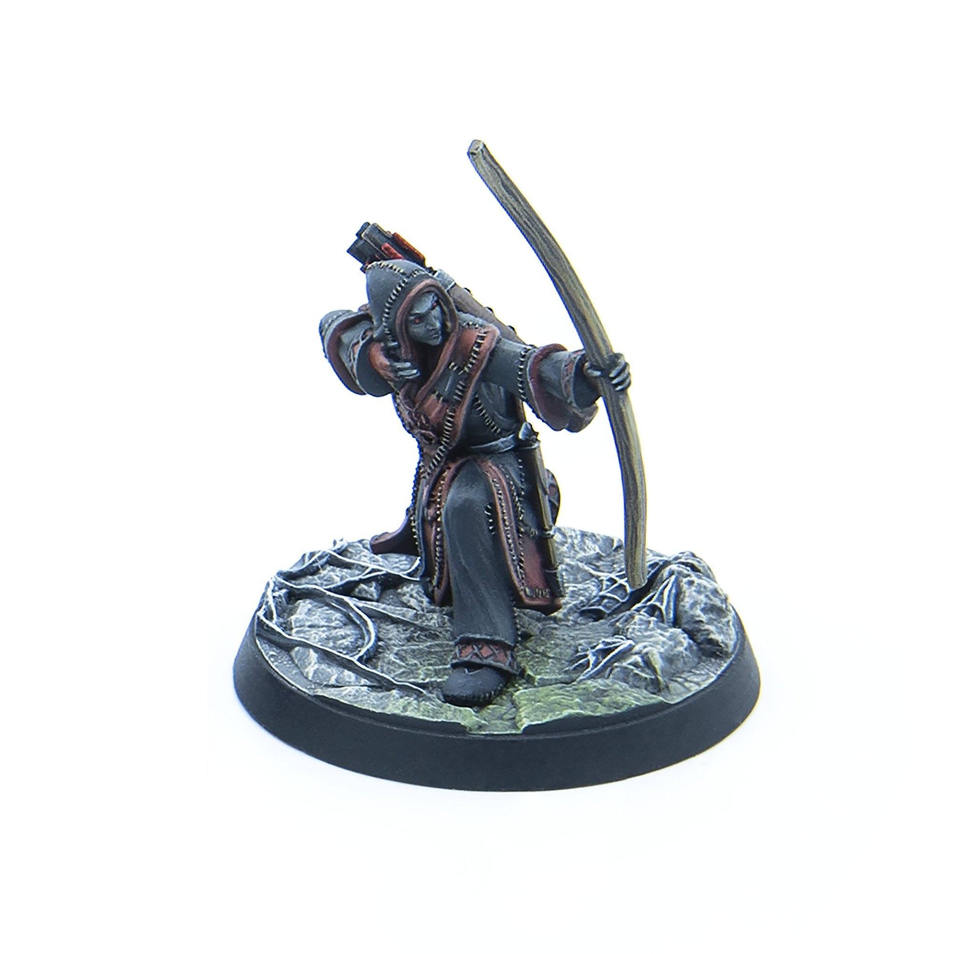 A hooded miniature figure with dark skin and red eyes, drawing a bow, standing on a rocky base