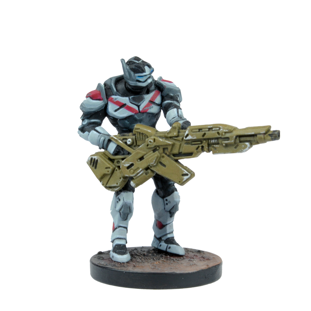 A miniature of a futuristic armored soldier in black and gray armor with red accents, holding a large olive-drab rifle