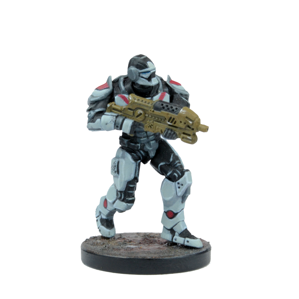 Sci-fi miniature of an armored soldier in black, white, and red armor, holding a gold assault rifle