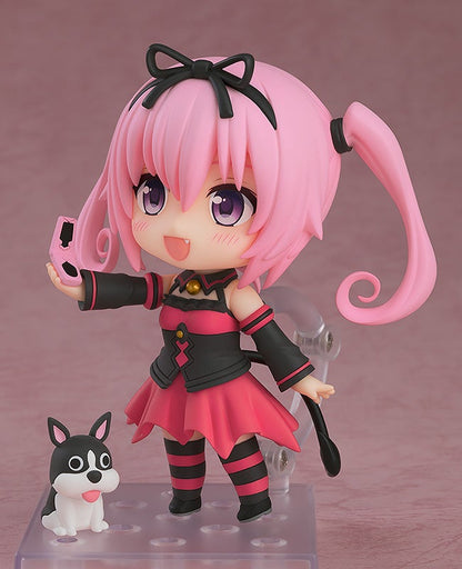 Figure with pink hair black and pink dress holding a phone with a small black and white dog figure