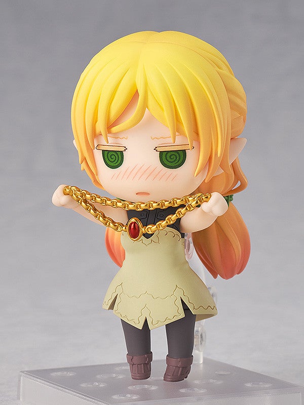 Elf figure seated with a soft, blushing expression holding her knees