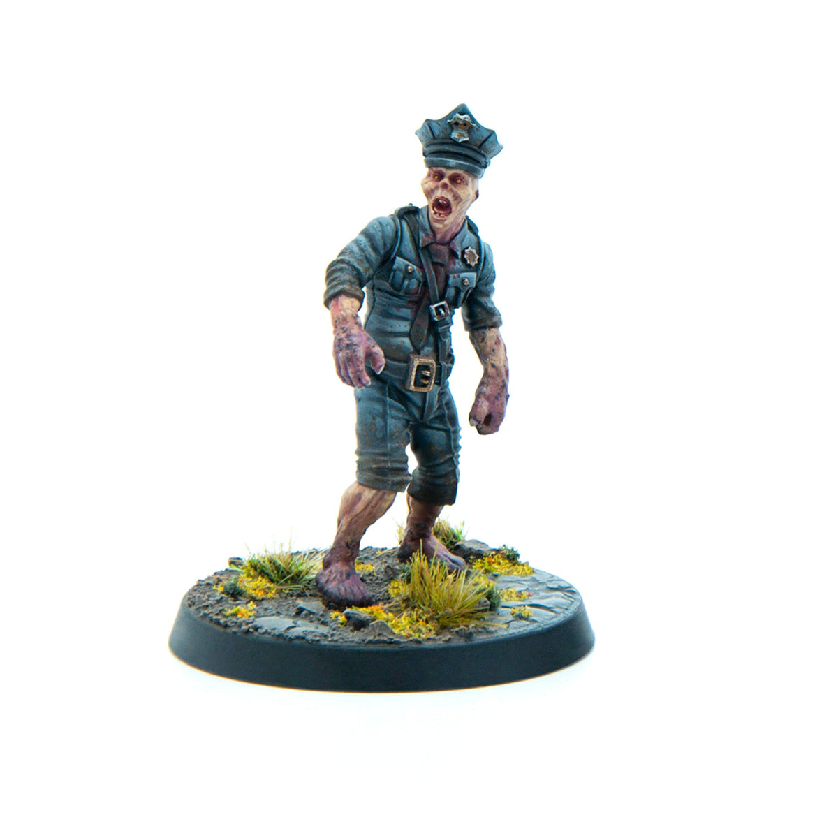Miniature zombie police officer in tattered blue uniform and cap, mouth open, lurching forward on a scenic base
