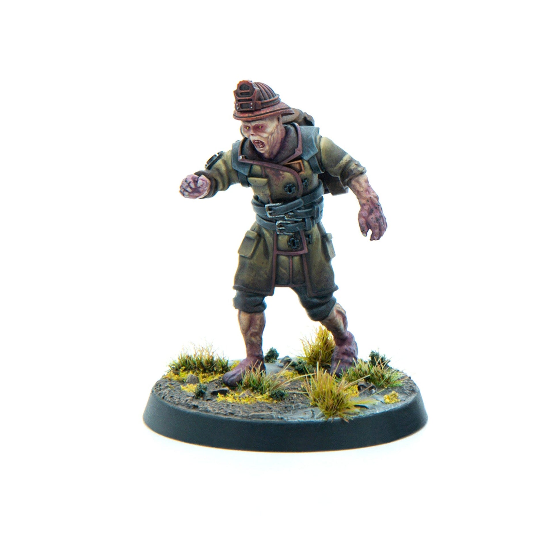 A miniature of a zombified miner in an olive uniform and hard hat, lunging forward with an open mouth