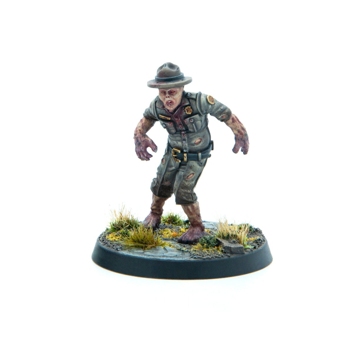 A miniature zombie park ranger in a tattered, bloody uniform, standing menacingly on a dirt and grass base