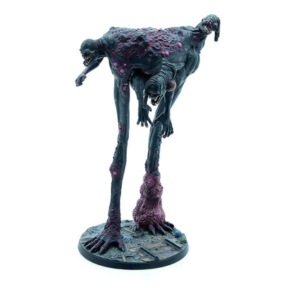 A tall, grotesque multi-headed creature with dark skin and purple lesions stands menacingly on a ruined base.