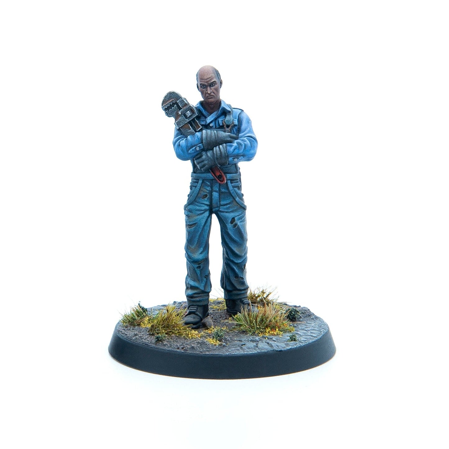 A miniature bald worker in blue overalls grimly holding a large pipe wrench across his chest on a textured base.