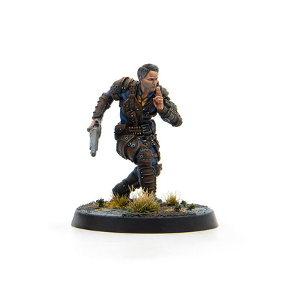 Miniature of a man in brown and blue armor, holding a pistol, crouching, and shushing.