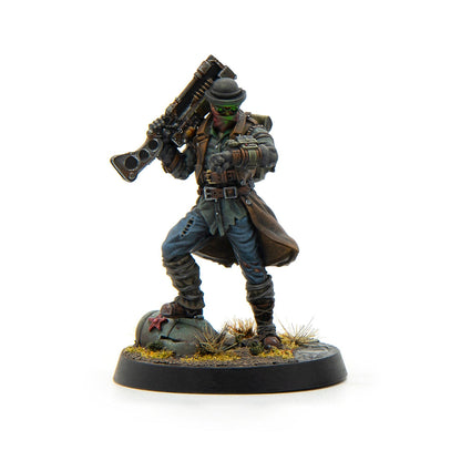 Miniature figure: character in trench coat, bowler hat, green goggles, holding rifle, checking wrist device.