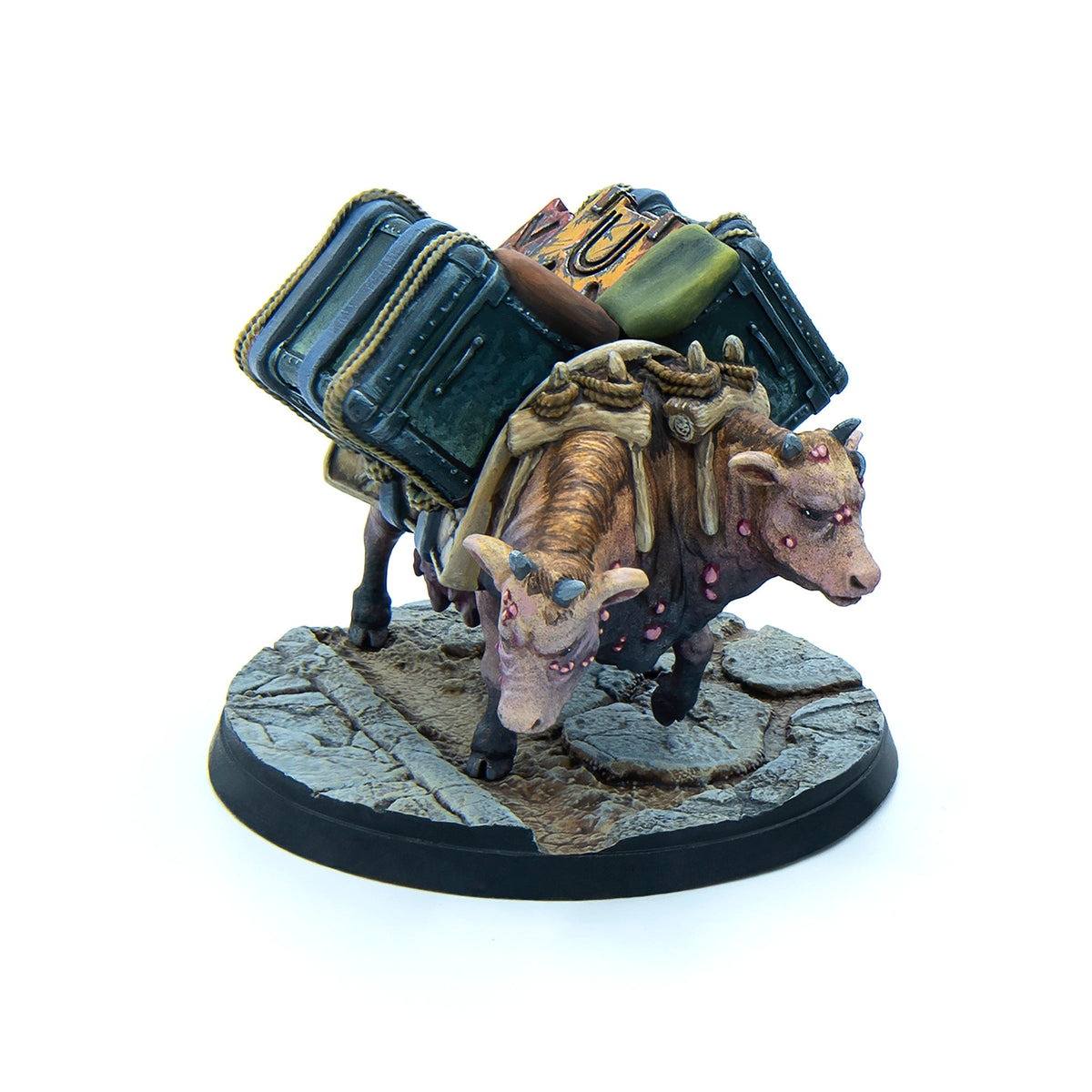 A miniature depicting two brown mutated cows laden with large trunks and bags, standing on a grey cobblestone base