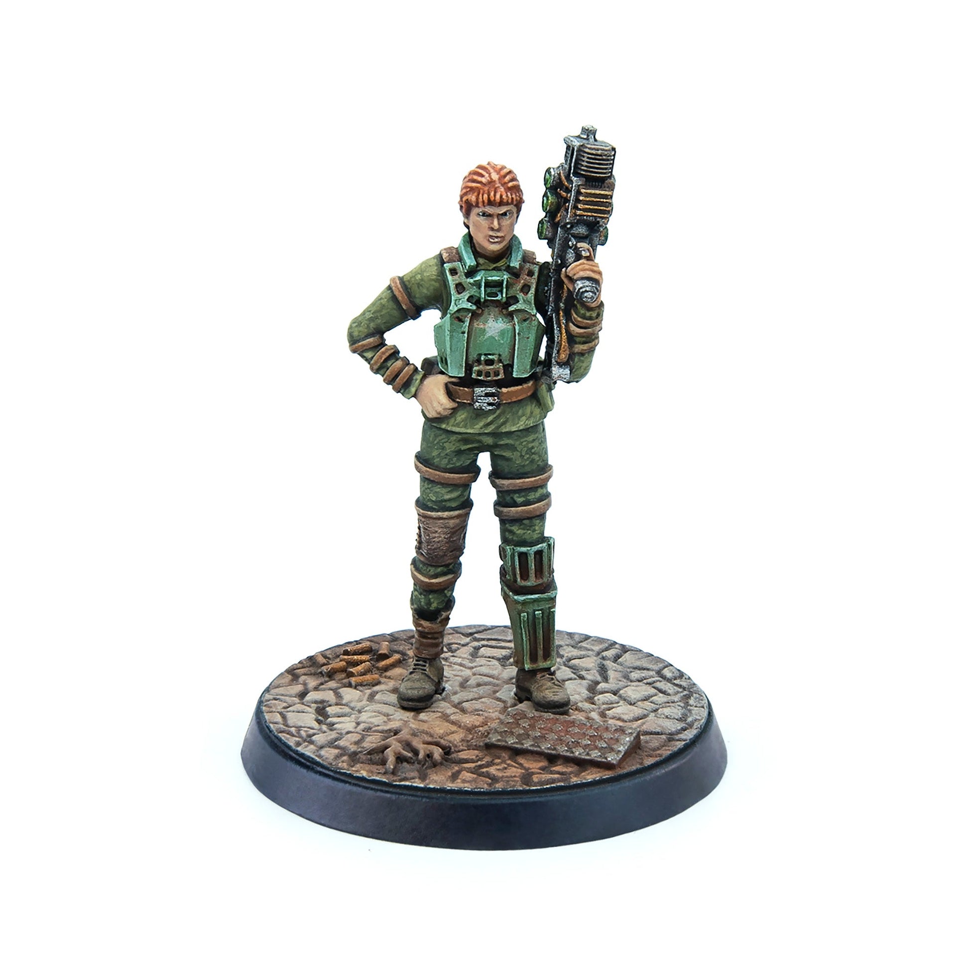 Red-haired female miniature in green armor, holding a futuristic rifle, standing on a detailed base