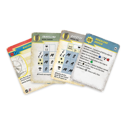 Four worn Fallout game cards, including "Nukalurk Queen," "Radstag," and "Traveling," fanned out on a white surface