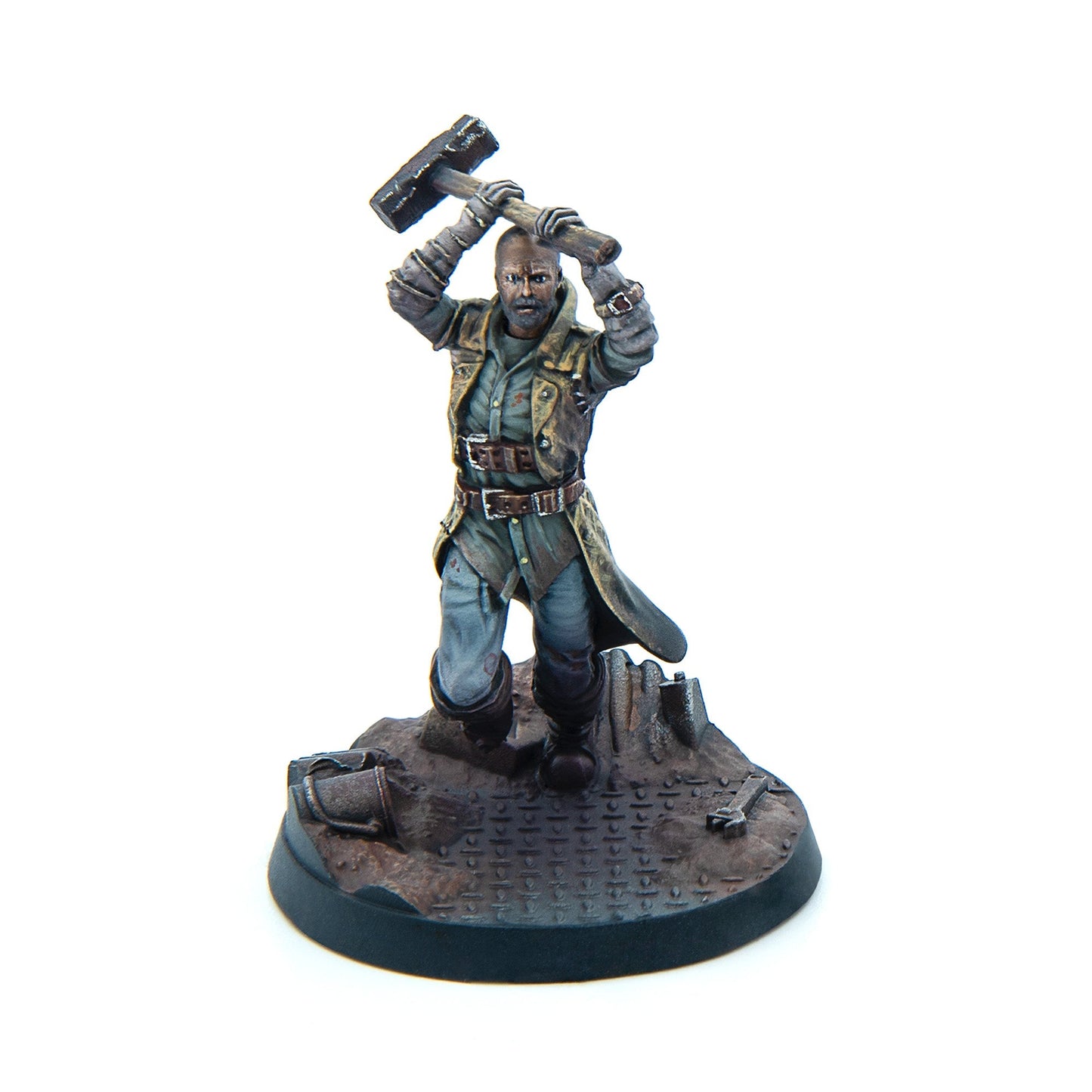 Miniature: Bald, bearded man in a weathered coat raising a large sledgehammer over his head, ready to strike