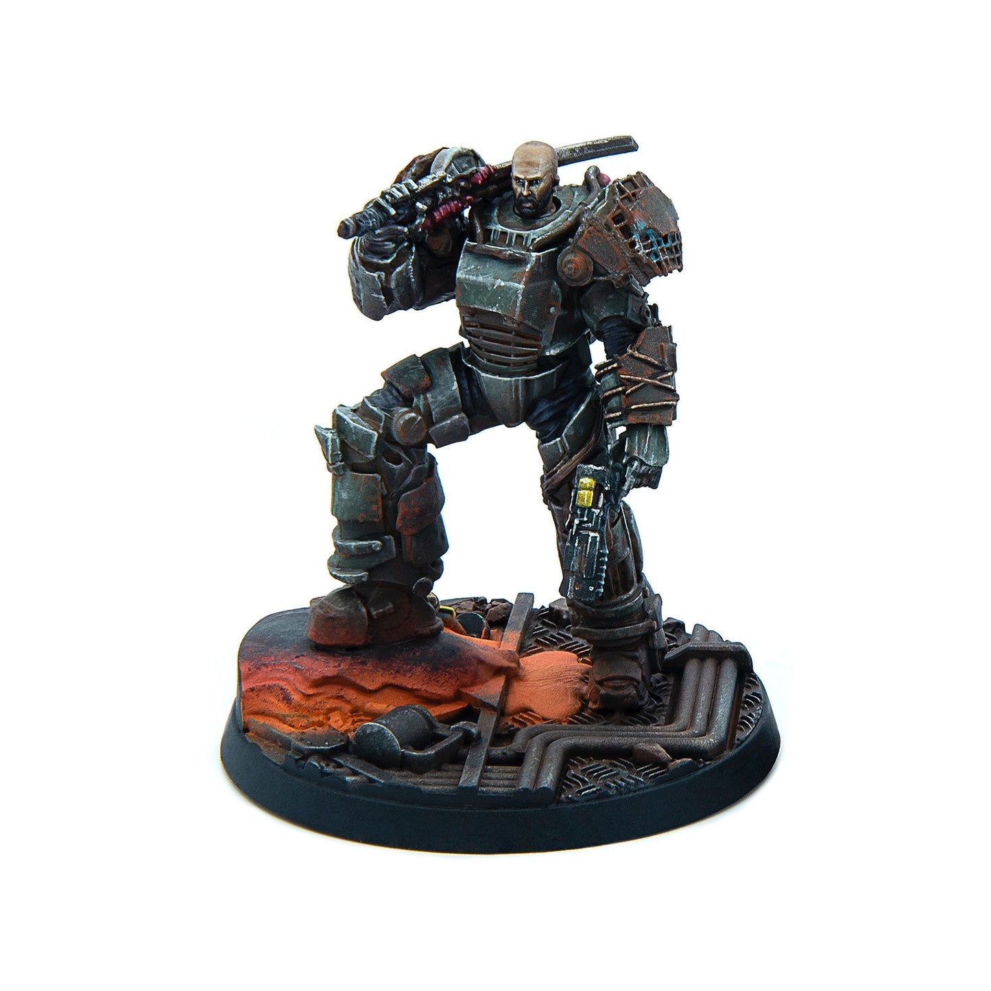 Weathered sci-fi miniature of a bald, bearded warrior in power armor, a sword on his back and pistol in hand, on a molten industrial base