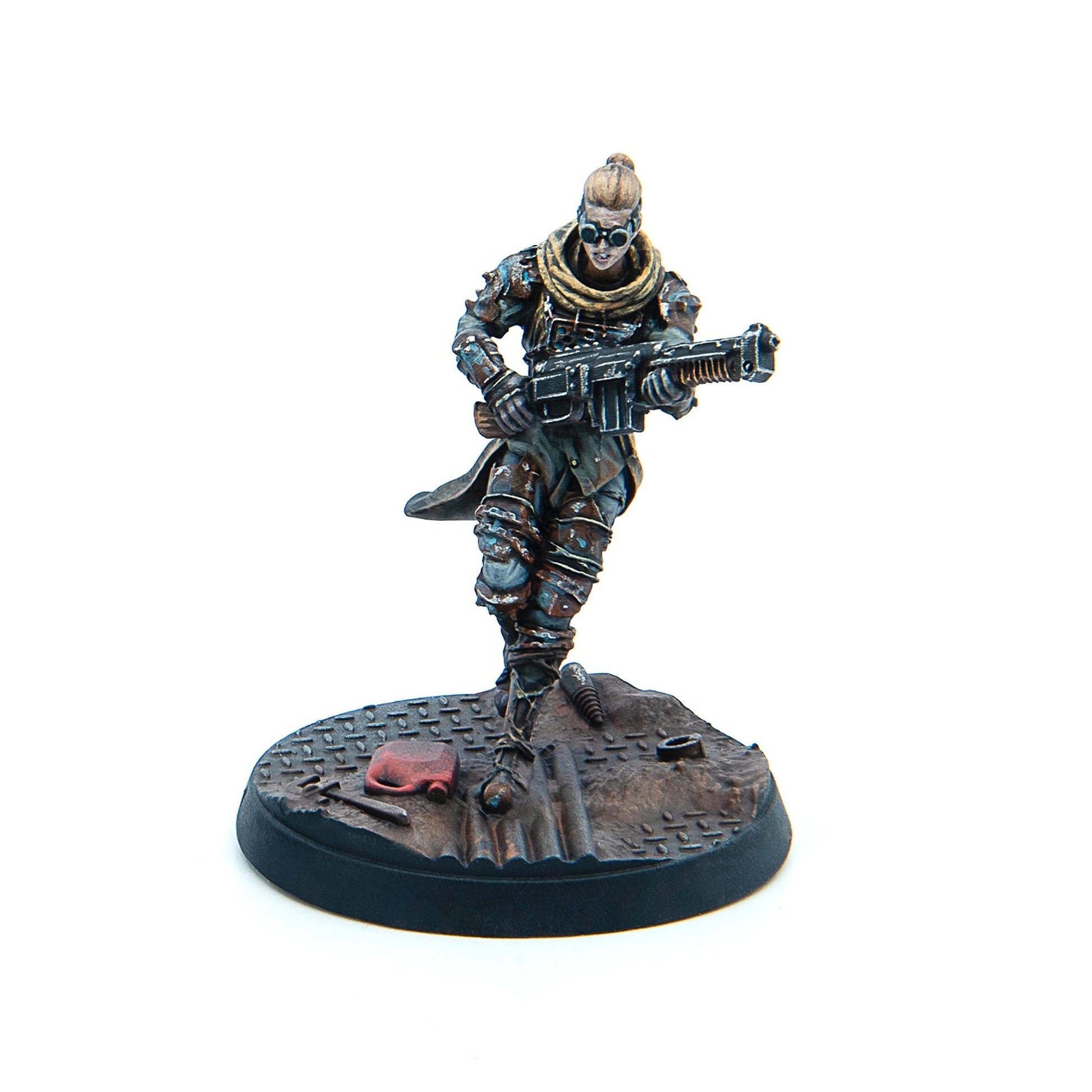 Painted miniature: female character with a top bun and goggles, armored, running with a heavy rifle