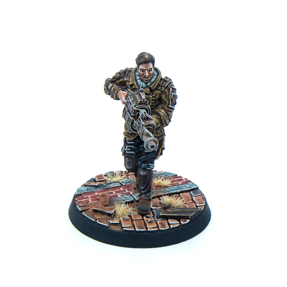 Miniature male figure in brown uniform running, holding a futuristic rifle, on a ruined brick base