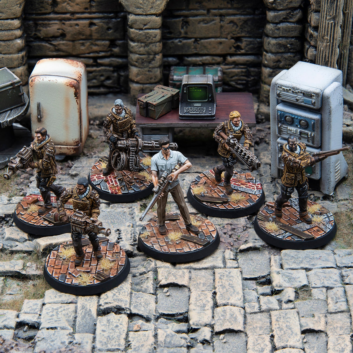 Six armed miniature figures in a post-apocalyptic scene - one has a sniper rifle, others wield heavy weapons