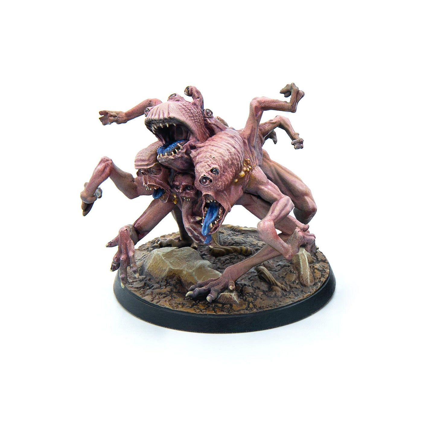 A multi-headed, multi-limbed pinkish-red monster miniature with blue tongues stands on a rocky base