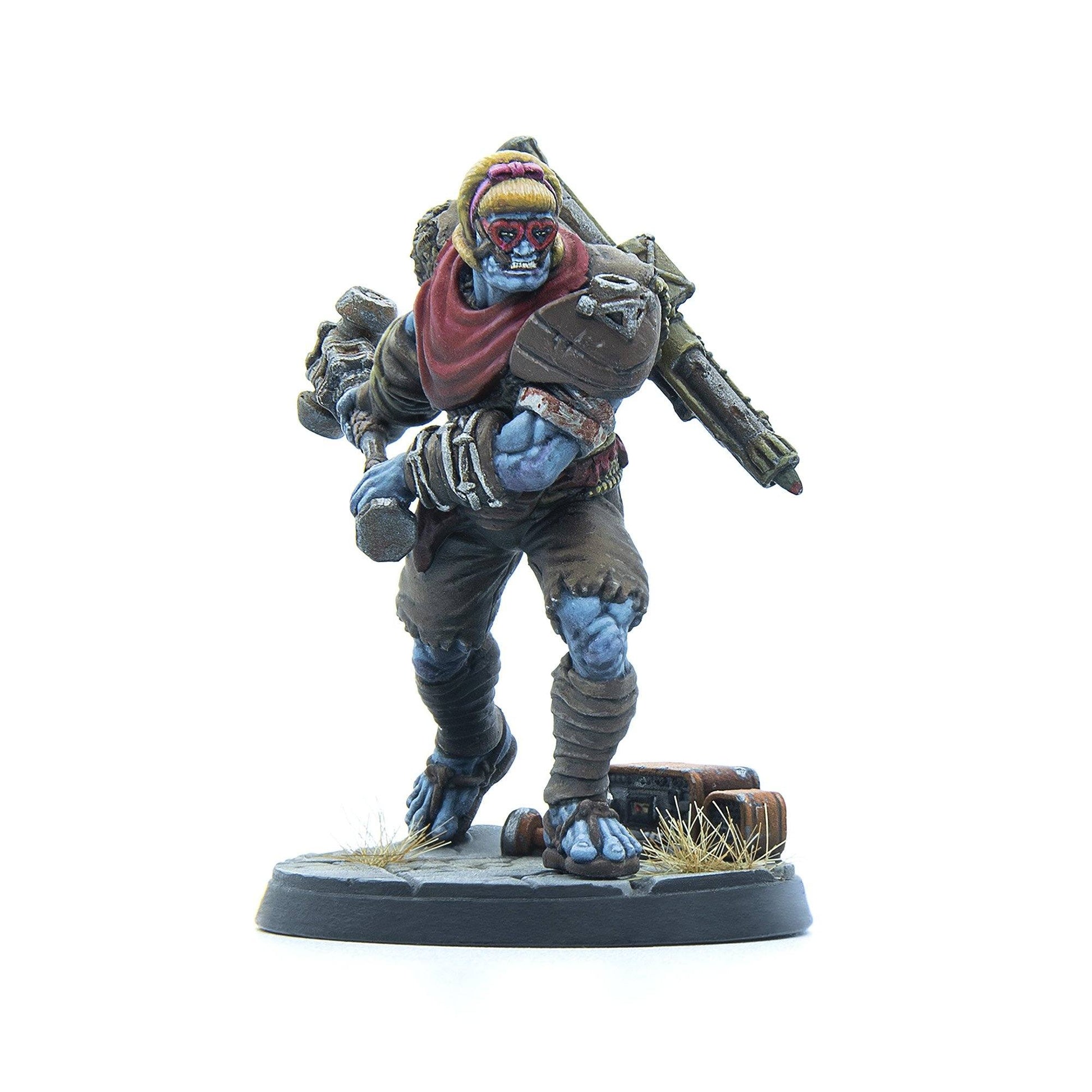A painted miniature of a blue-skinned brute wearing heart-shaped glasses, holding a two-headed club and carrying a heavy weapon