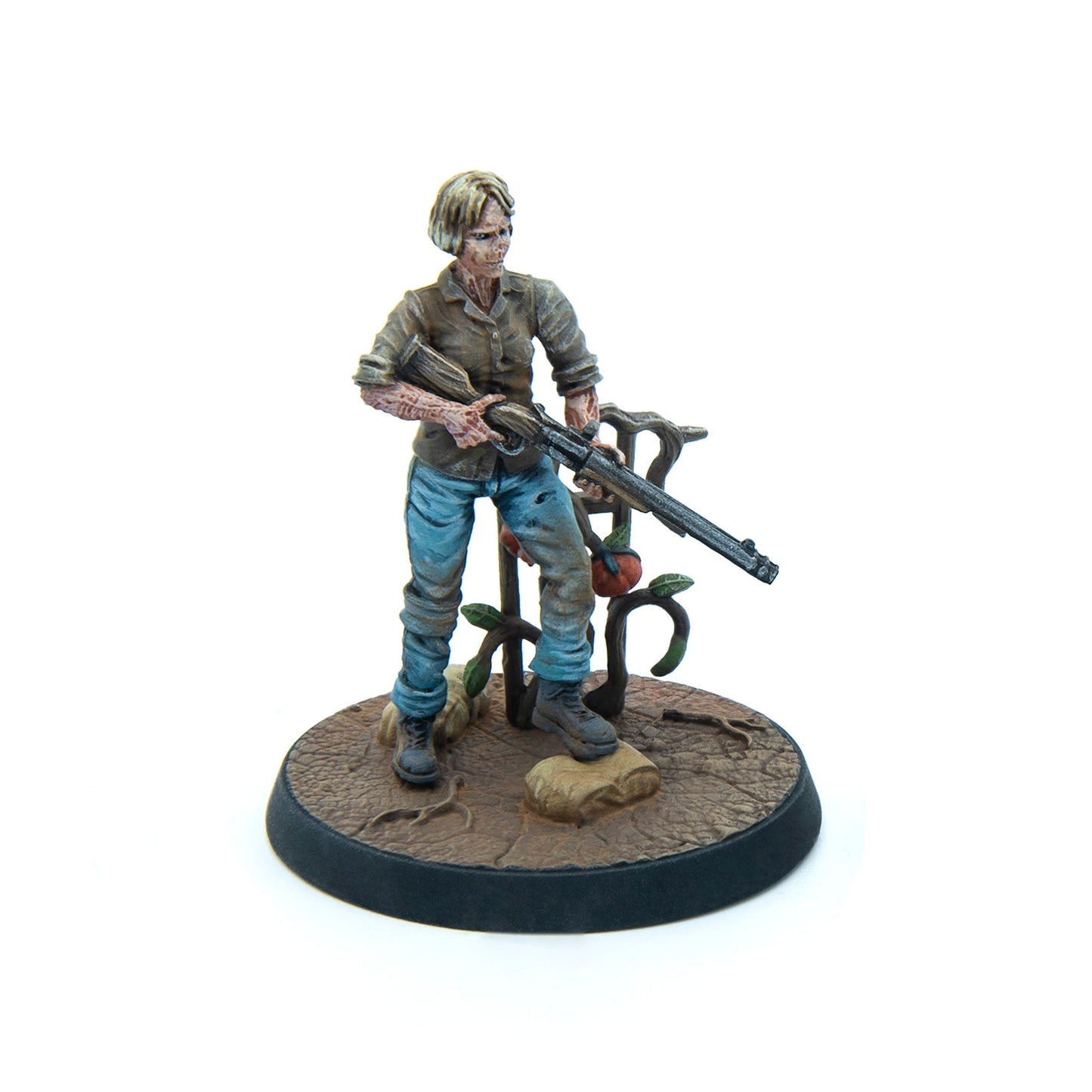 Miniature of a gaunt female figure with exposed flesh, holding a rifle, standing next to a tomato plant on a base