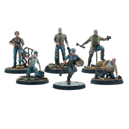 Six painted miniature figures of scarred Fallout Ghouls in rugged clothing, armed with various weapons and supplies