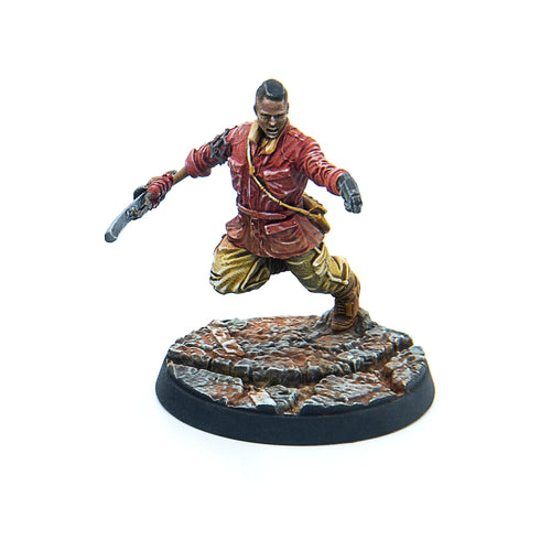 Close-up view of the unpainted Jake Finch miniature from Fallout: Wasteland Warfare, showing sculpted weapon and outfit details