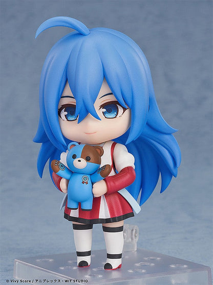 Blue-haired anime Nendoroid figure in white and red outfit holding a small blue bear with brown ears