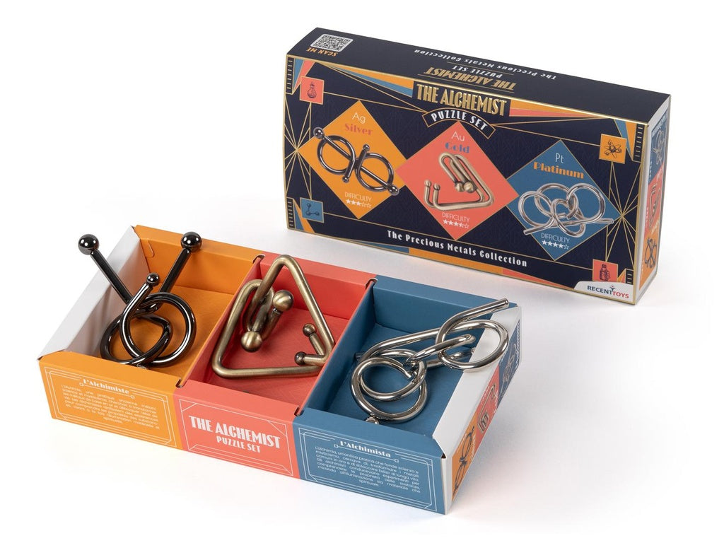 The Alchemist Puzzle Set box and three metal wire disentanglement puzzles (Silver, Gold, Platinum) displayed in their tray