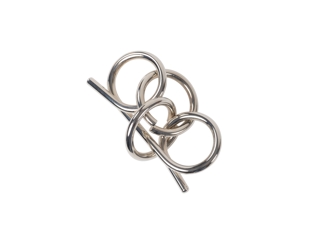Silver wire puzzle (disentanglement puzzle) consisting of three interconnected loops against a black background