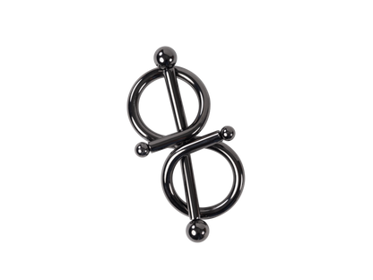 Dark metal figure-eight body jewelry clamp with two rings and spherical ends, against a black background