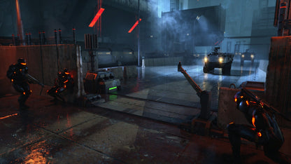 Three dark armored soldiers with orange glow hide behind barriers as military vehicles approach on a rainy night