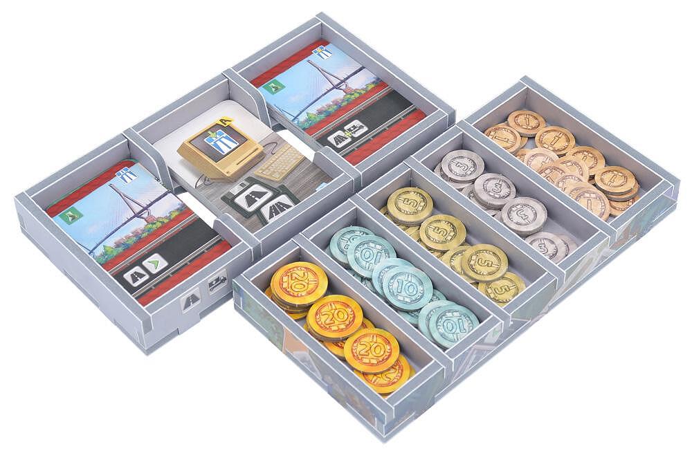 Insert organizer with various game pieces sorted in compartments