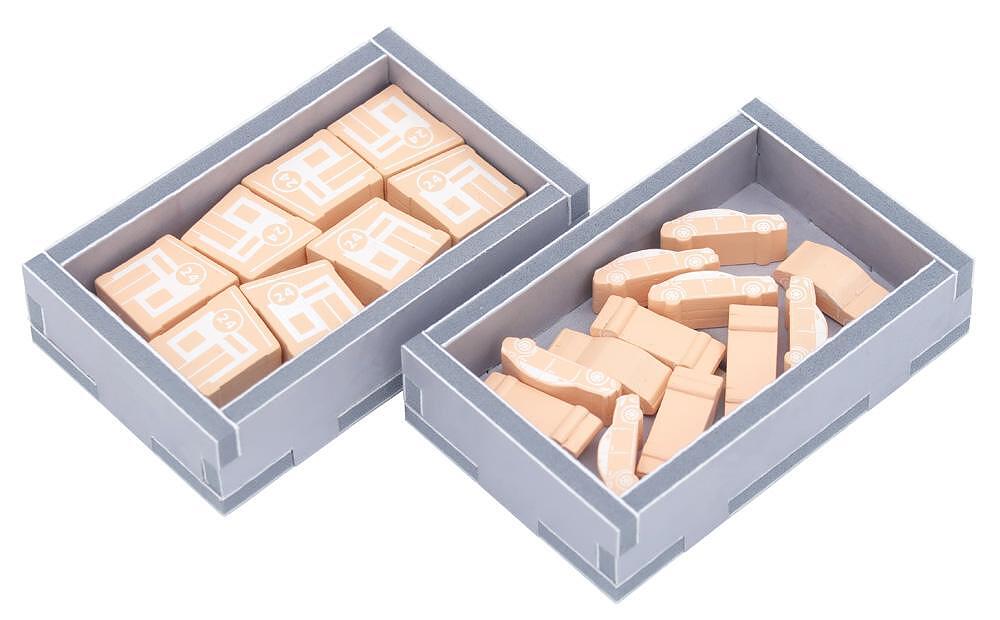 Angled view of insert organizer holding cards and miniatures