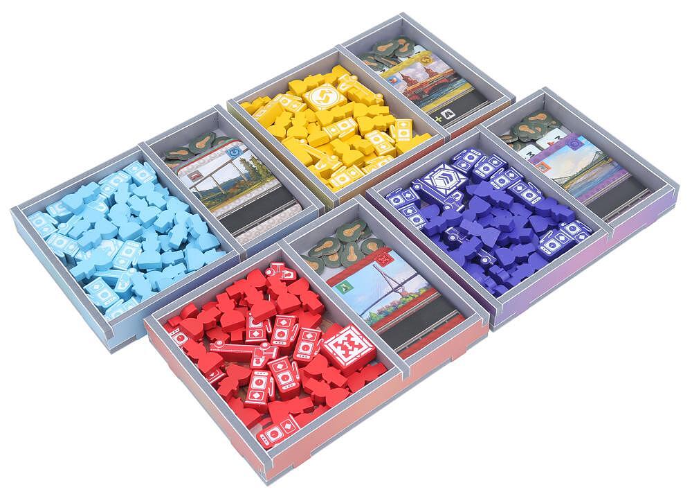 Close-up showing compartments with cards and tokens