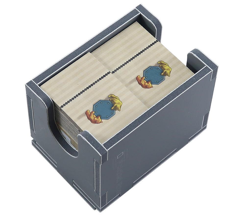 Close-up of insert compartments filled with Barenpark tiles and pieces