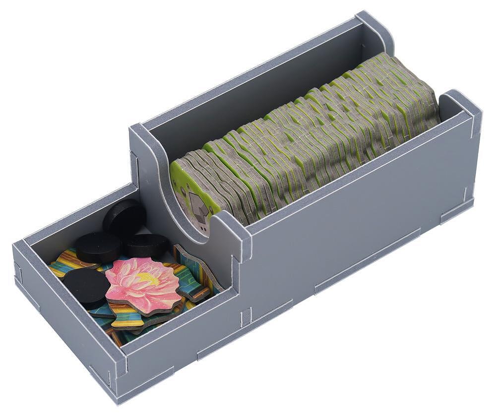 Game insert with the box lid removed, showing organized compartments