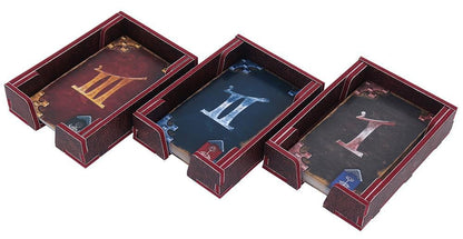 Close-up of compartments holding game pieces and cards