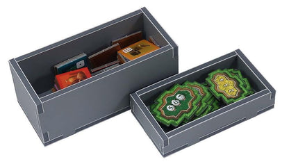 Close-up of the Folded Space insert showing divided slots for game pieces and dice