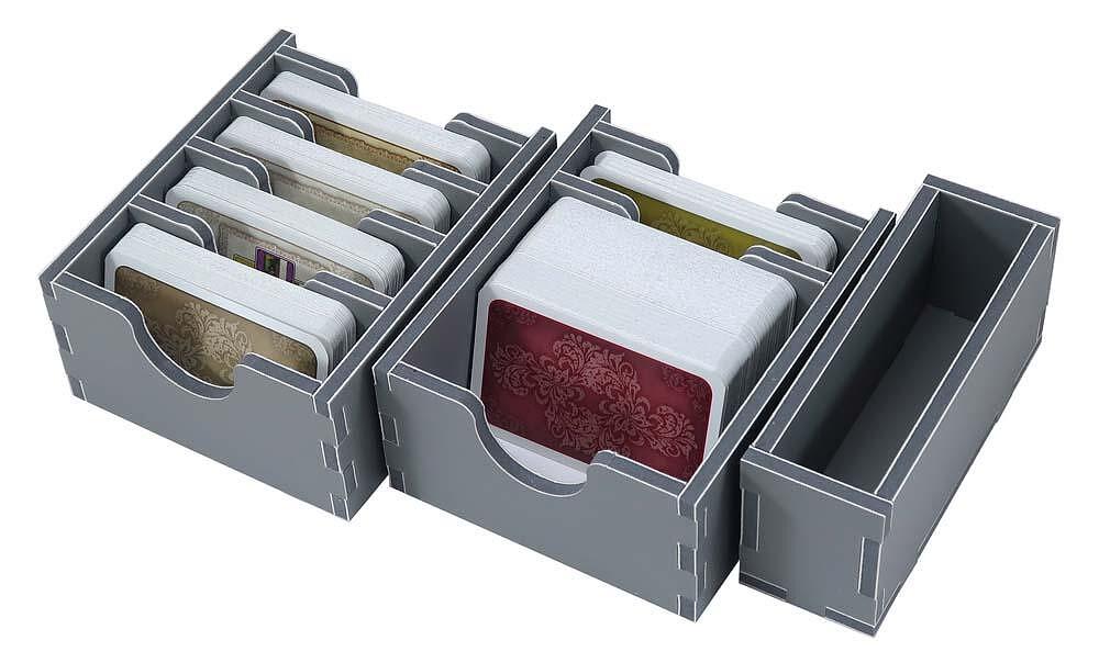 Folded Space insert filled with game components, including cards, dice, and tokens