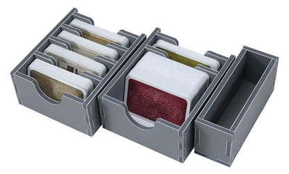 Folded Space insert filled with game components, including cards, dice, and tokens