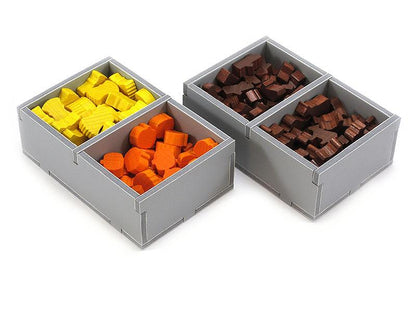 Folded Space Caverna game insert with yellow, orange, and brown resource tokens in gray trays