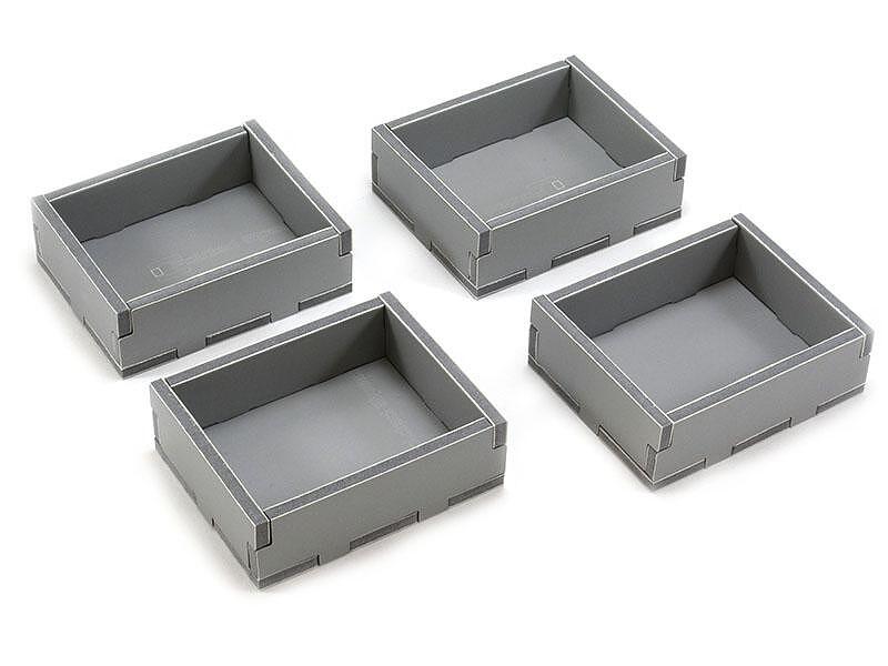 Four gray folded storage inserts for board game components