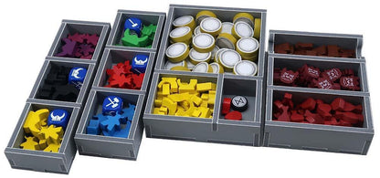 Close-up of organizer compartments holding various game components